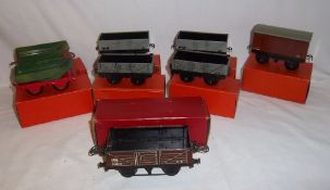 8 Hornby O gauge tinplate wagons inc. 2 rotary tipping wagons, goods van etc.
