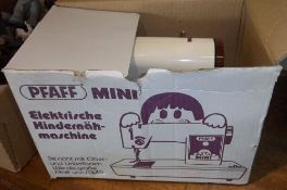 Child`s Pfaff mini sewing machine in original box