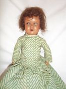 Composition doll with sleeping eyes & open mouth, the head with unclear mark on jointed