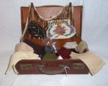 Leather suitcase containing gloves, evening bags, miniature sewing kit, jewellery boxes etc.