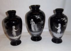 Set 3 black glass vases with Mary Gregory style enamel dec.