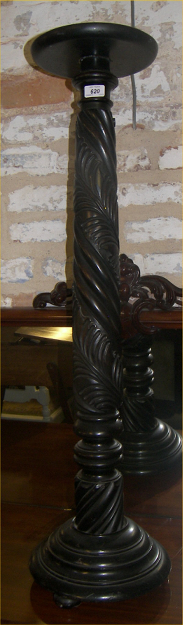 Ebonised, carved plant stand