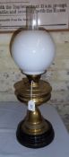 Brass paraffin lamp with opaque glass shade