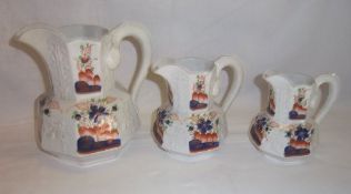 Set 3 Gaudy Welsh graduating jugs with serpent handles