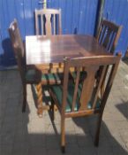 Draw leaf dining table with 4 oak dining chairs