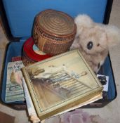 Suitcase containing children's books, toy Koala, tin of buttons etc.