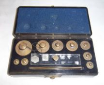 Set. brass weights in bakelite case marked Philip Harris Birmingham England