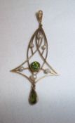 Tested as 9ct gold Art Nouveau style pendant set with peridot & seed pearls