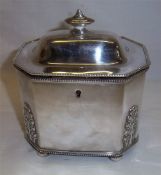 S.P octagonal tea caddy with domed lid, acanthus mounts & lockable lid