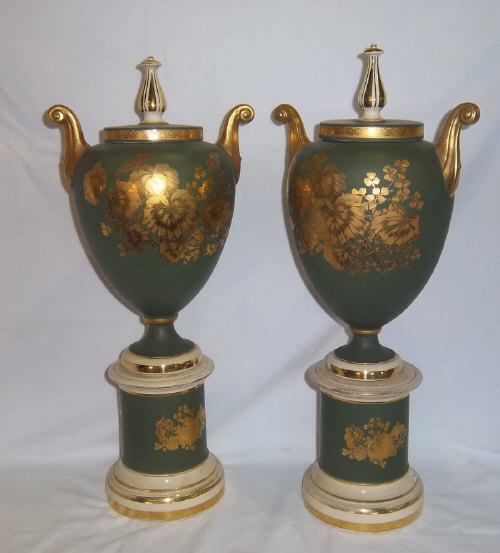 Pr amphoras on square stands with gilt floral dec. ht approx. 58cm