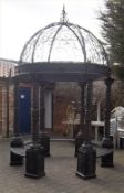 Cast & wrought iron gazebo with interior bench seating,  ht approx. 10` + finial, width approx. 7`