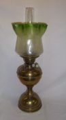 Brass paraffin lamp with green etched glass shade