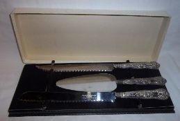 Boxed silver handled bread knife, carving knife & cake slice Sheff. 1959