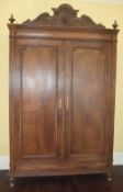 Lg. oak double armoire with decorative carved cornice ht approx. 242cm width approx. 146cm