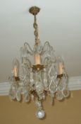 Gilt metal chandelier with cut glass droplets