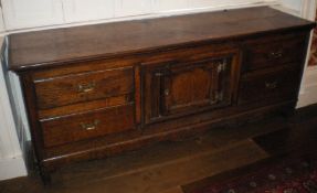 18th c. & later oak side cabinet with 4 drawers flanking central cupboard over a shaped apron on