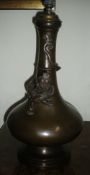 Oriental bronze table lamp with ascending applied dragon