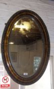 Oval mirror in carved mah. frame