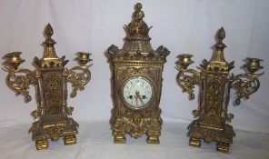 Brass cased 3 piece clock garniture, the clock with urn finial & scrolled appliques, ivorine