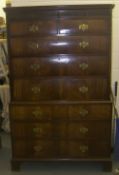 Geo. mah. chest on chest with dentill moulded pediment above 2 short & 6 graduated long drawers on