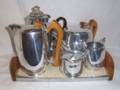 4 piece picquot ware teaset on matching tray & 1 other teapot