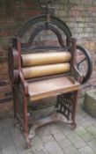 "The Excel" mangle with suppliers name "Christian & Dobbs Long Sutton" in bold relief