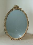 Oval gilt dressing table mirror