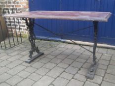 Garden table with decorative cast base