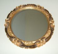 Circular gilt framed mirror