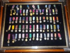 Framed sel. British miniature campaign & gallantry medals etc.