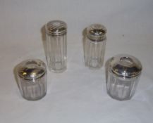 4 glass dressing table pots with silver lids