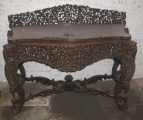 19th c. Anglo Indian console table with profusely carved floral & animal decoration
