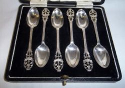 Cased set silver teaspoons with pierced decorative handles depicting thistles Edinburgh 1938