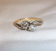 Tested as gold 2 stone diamond twist ring approx. 0.25ct each