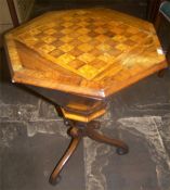 Heptagonal games table with inlaid chequerboard to top and splayed tripod base