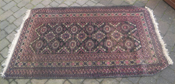 Wool rug on black ground size approx. 195cm x 116cm