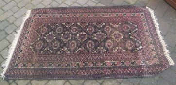 Wool rug on black ground size approx. 195cm x 116cm