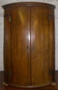 Geo. oak barrel shaped corner cabinet