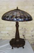 Tiffany style lamp on cast tree trunk base with lg. domed leaded shade ht approx. 74cm