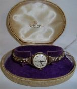 9ct gold Smiths De-Luxe ladies wristwatch on rolled gold expandable strap