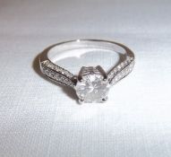 14k white gold diamond solitaire ring with diamond set shoulders approx. 1.0ct