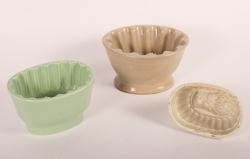 A collection of twenty-one jelly moulds, various plant and fruit designs