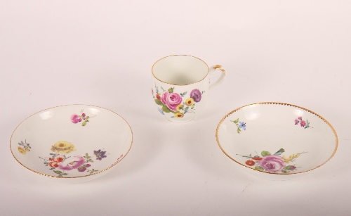A 19th Century Meissen porcelain floral decorated cabinet cup and saucer, a similar saucer and a