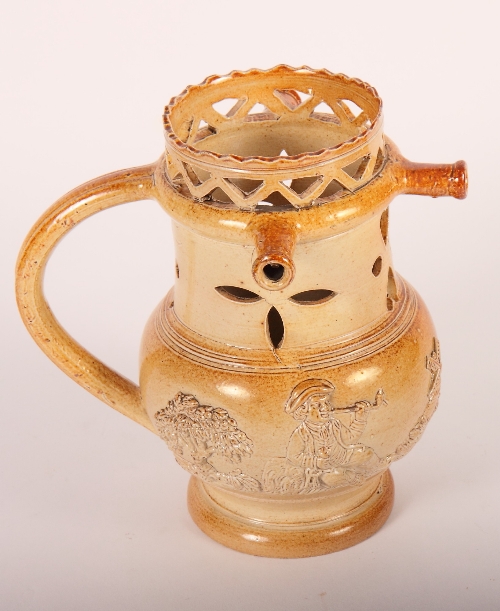 A 19th Century salt glazed puzzle jug, 8" high (illustrated)