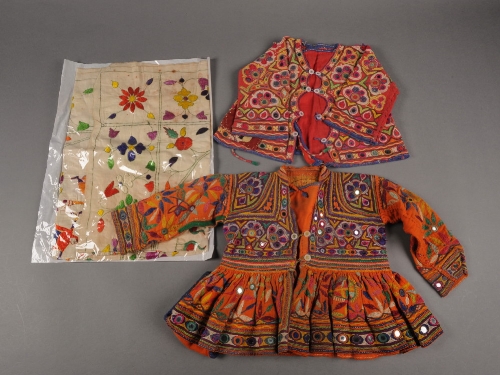 A Kutch child`s dress with shisha and embroidered decoration, a similar child`s jacket and a