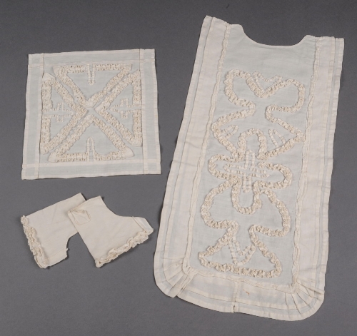 A child`s 18th Century baptismal/first communion set comprising tabard front, head square and