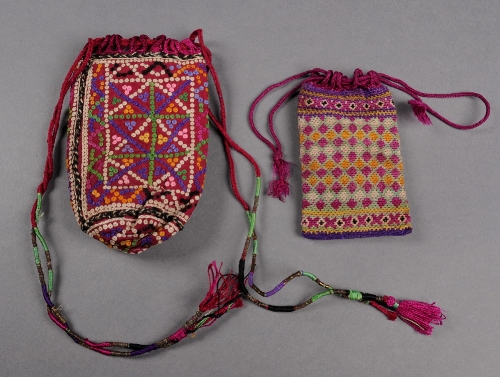 An early 19th Century Iranian drawstring purse embroidered with buttonhole wheels and a 19th Century