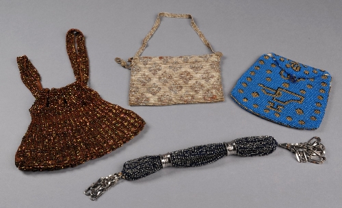 A 1920s evening bag embroidered with silver beads, a 19th Century beaded purse worked with blue