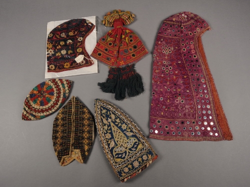 A Kutch hood decorated with shisha, an Azerbaijani gentleman`s nightcap, a Rajasthan child`s cap,