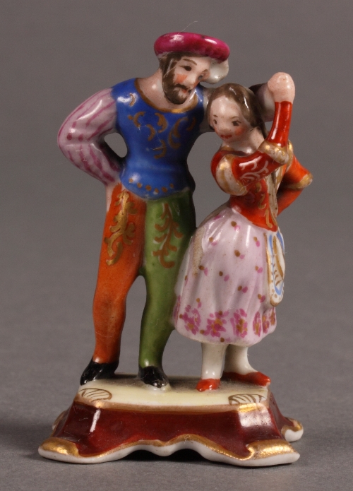 A 19th Century Popov miniature porcelain figure group of two dancers in period costume, 2 1/4" high,